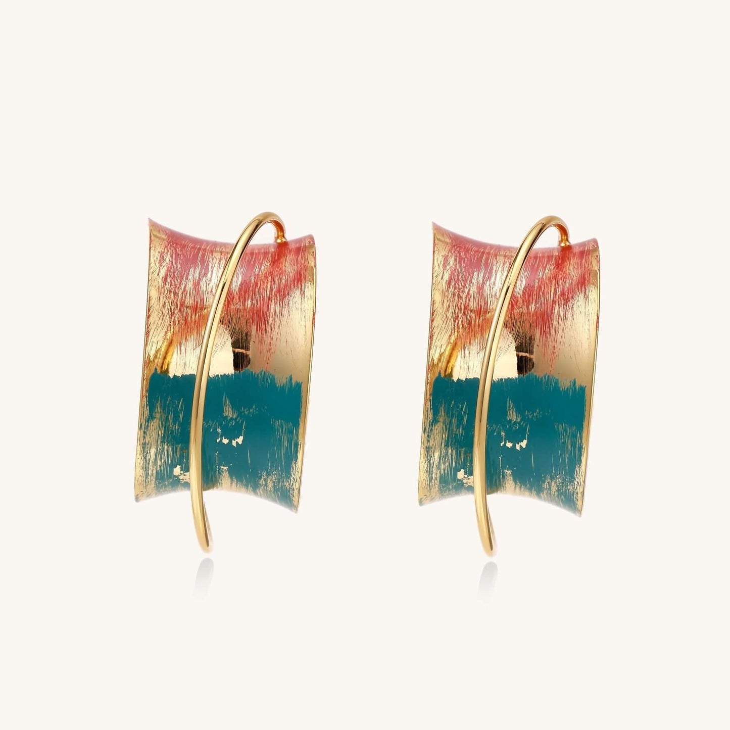 Gold-plated hoop earrings with colorful enamel brushstroke patterns in turquoise, coral, and gold tones