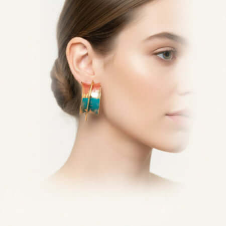 Model wearing Sunset Mirage Hoops earrings featuring turquoise and coral ombré design.