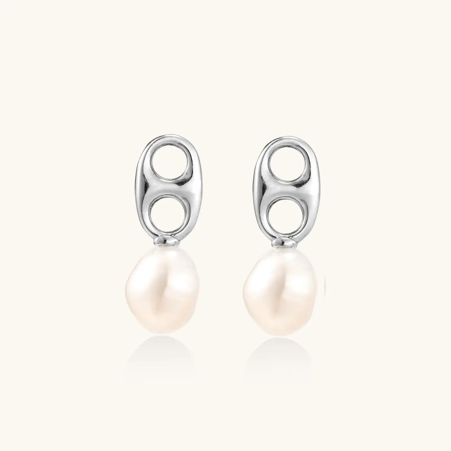 Modern rhodium-plated silver earrings with geometric double-circle design and freshwater pearl drops