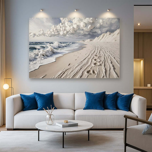 Footprints in the Sand Canvas Wall Art displayed in a modern living room with beach scenery and clouds.