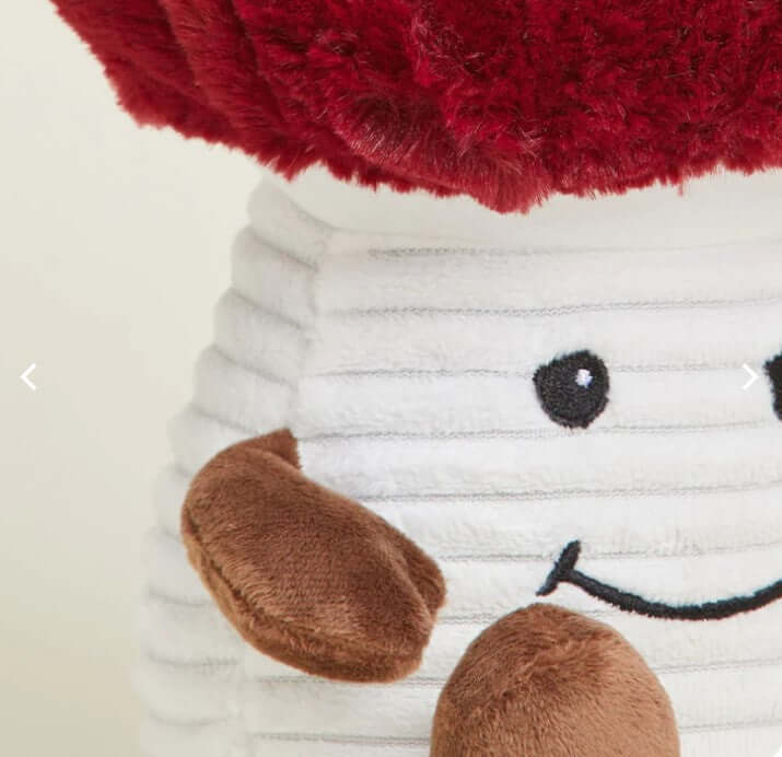 Microwavable lavender plush mushroom with a red top and brown arms, perfect for soothing warmth and comfort.
