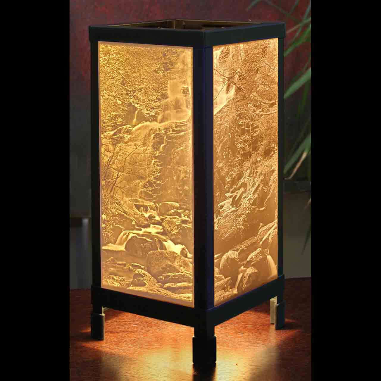 Waterfall Luminaire Tabletop Lamp showcasing handcrafted porcelain lithophane with illuminating scenic design.