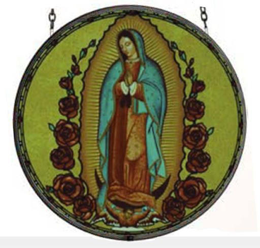 A round stained glass panel featuring the image of Our Lady of Guadalupe with a blue-green mantle, surrounded by a yellow and red decorative border with roses.