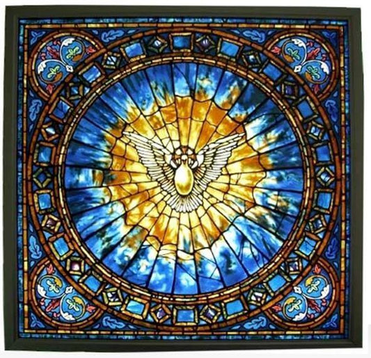A stained glass window depicting the Holy Spirit with a central figure and blue and yellow radiant background.