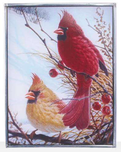Stained glass window panel featuring a male and female Northern Cardinal perched on branches with a sky background.