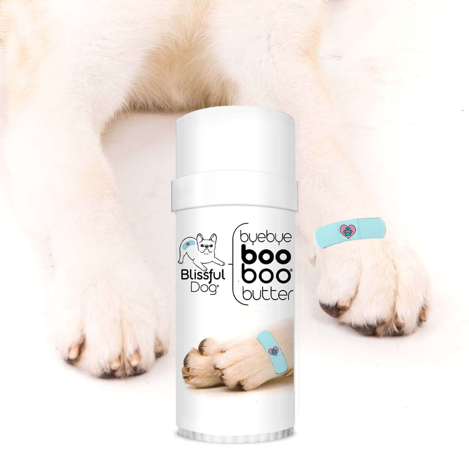 1 Dog Bye Bye Boo Boo Butter bottle beside a dog's paw with bandages, soothing skin irritation.