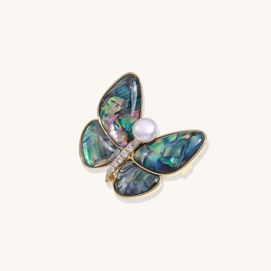 Rainbow Butterfly Brooch featuring iridescent abalone wings and a freshwater pearl centerpiece.