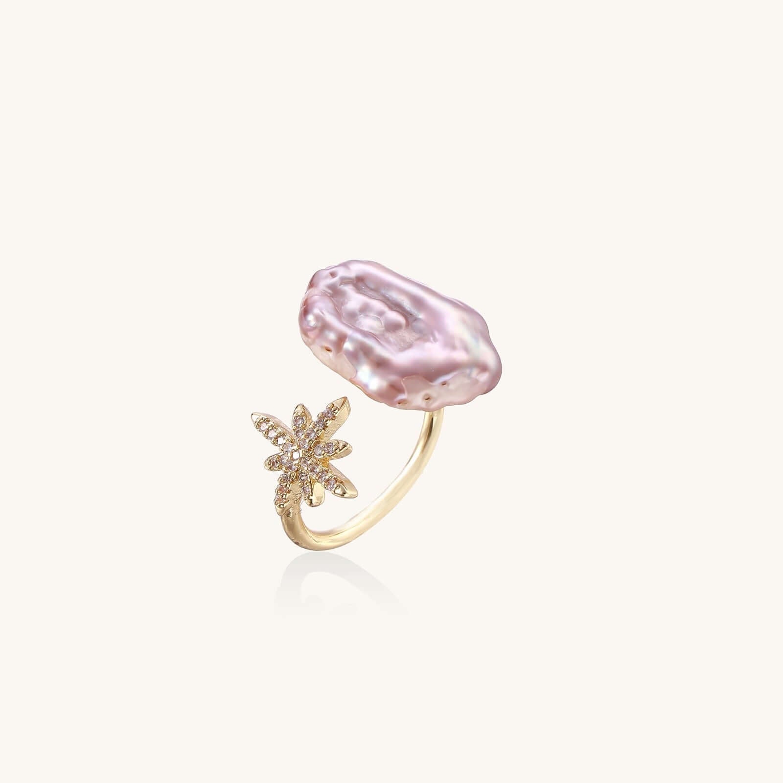 Starlit Pearl Dreams Ring featuring a baroque freshwater pearl and a sparkling star charm on an adjustable band.