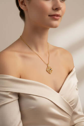 Celestial Wisdom Pendant on a model wearing an elegant off-shoulder top, showcasing vintage romance and modern mystique.