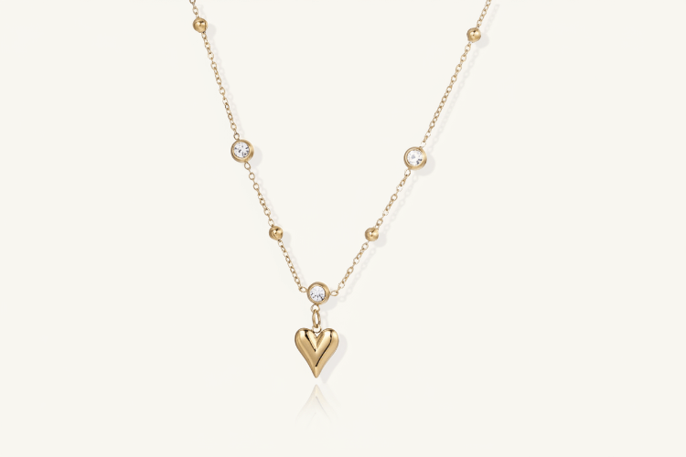 Crystal Heart Charm Necklace Women's Costume Jewelry with gold chain and sparkling crystals.