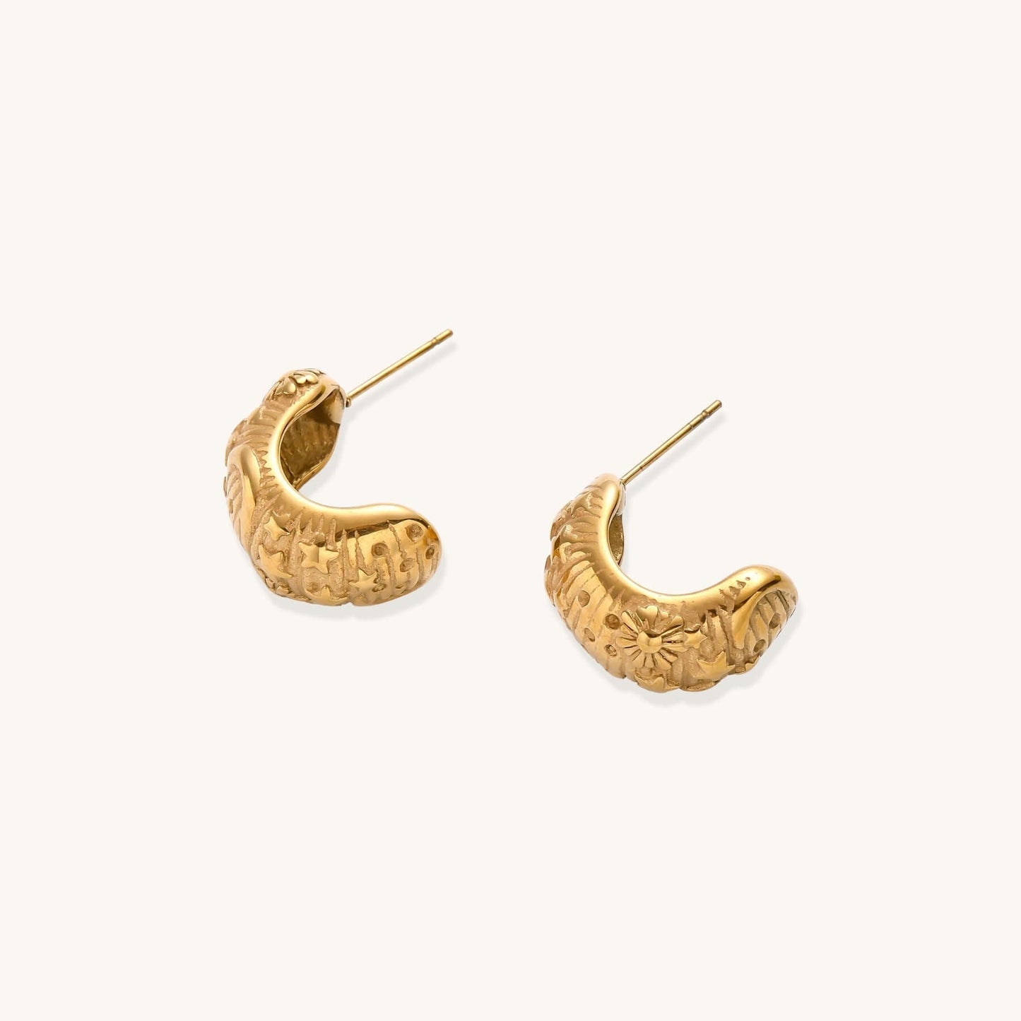 Celestial Dreams Hoops earrings featuring 14K gold-plated stainless steel with mystical sun and star engravings.