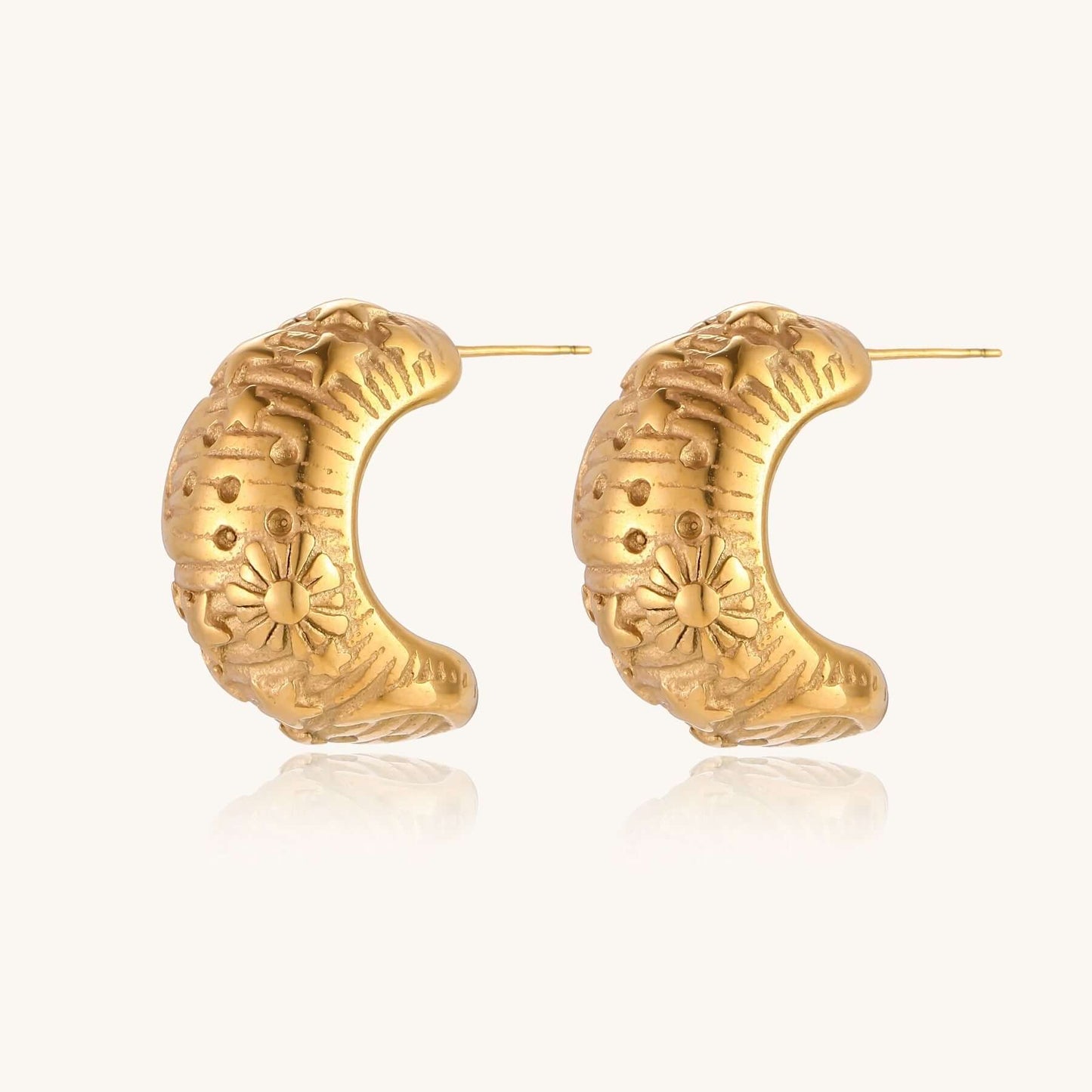 Celestial Dreams Hoops earrings featuring gold-plated stainless steel with mystical sun and star engravings.