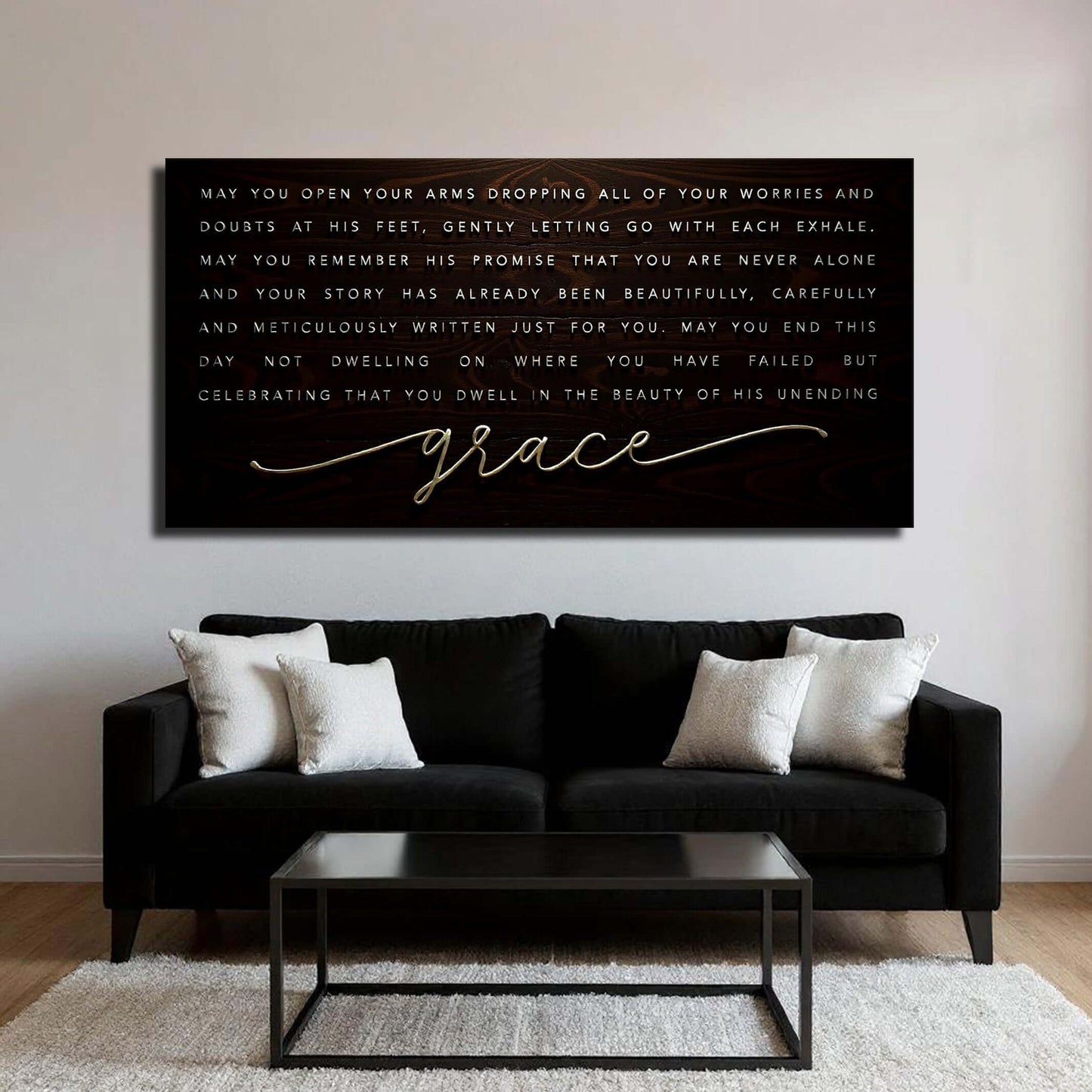Unending Grace Faith Sign IV displayed above a modern black sofa in a stylish living room