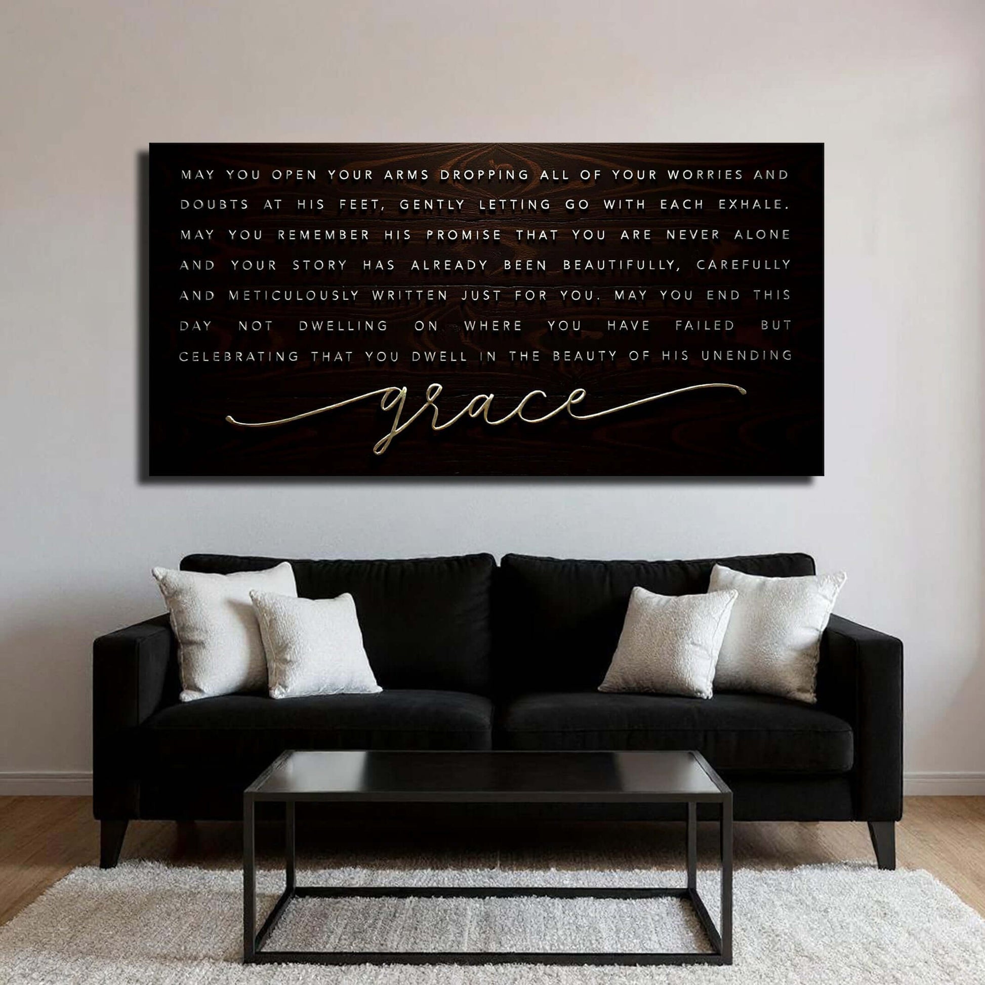 Unending Grace Faith Sign IV displayed above a modern black sofa in a stylish living room