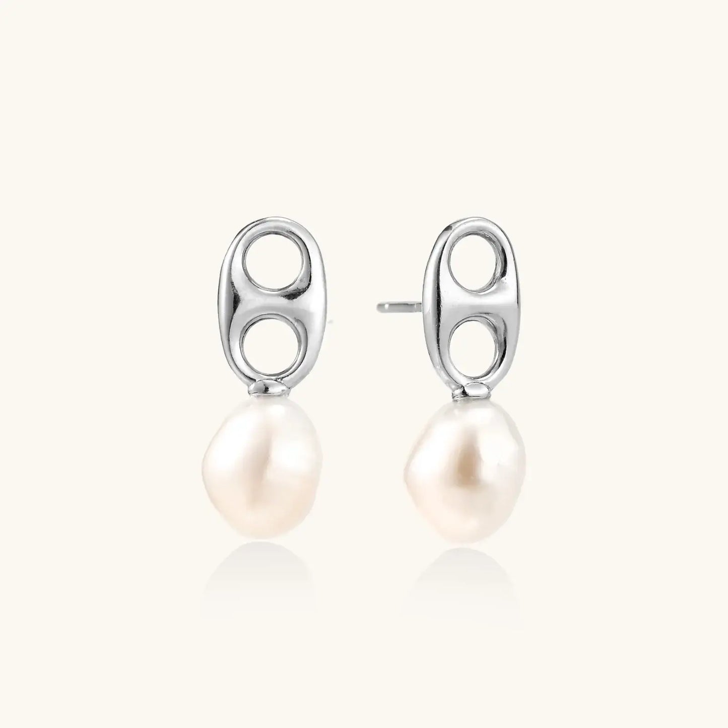 Modern rhodium-plated silver earrings with geometric double-circle design and freshwater pearl drops