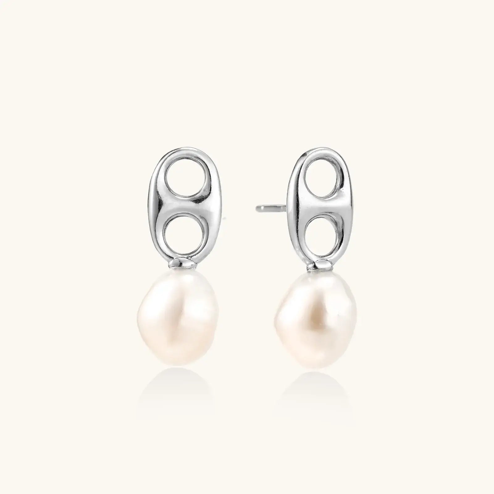 Modern rhodium-plated silver earrings with geometric double-circle design and freshwater pearl drops