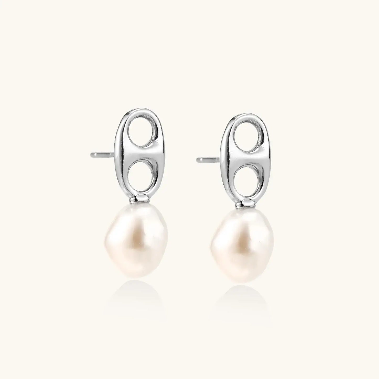 Modern rhodium-plated silver earrings with geometric double-circle design and freshwater pearl drops