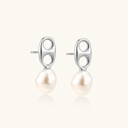 Modern rhodium-plated silver earrings with geometric double-circle design and freshwater pearl drops