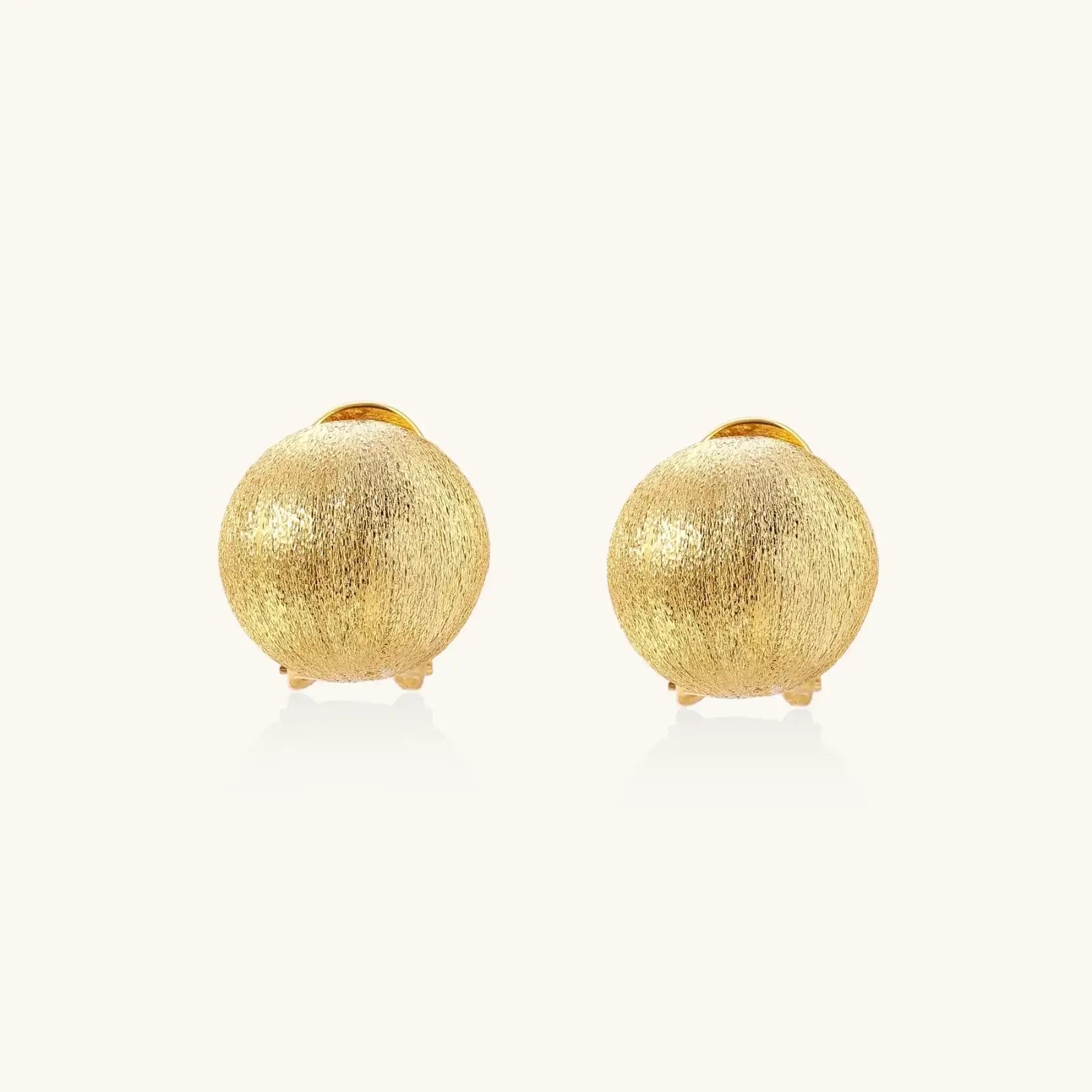 Brushed Gold Dome Clips earrings featuring brushed-satin finish in sculptural dome design.