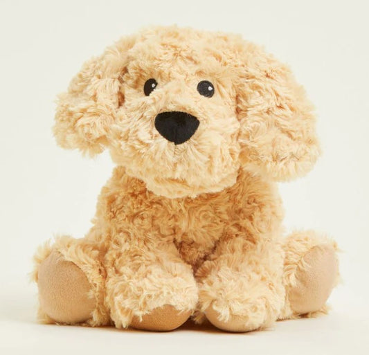 A plush toy resembling a golden dog with a soft, fluffy texture, seated upright.