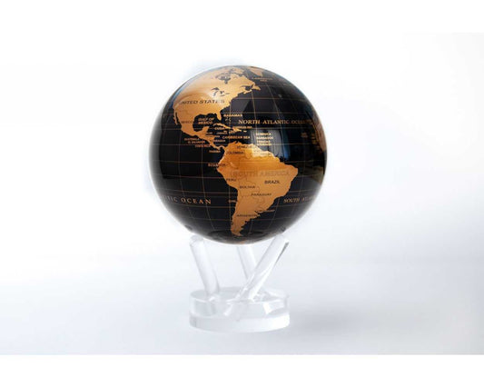 A black and gold MOVA Earth Globe with rotating gold landmasses on a jet-black ocean, displayed on a clear stand.