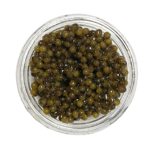 Kaluga hybrid caviar in a glass container showcasing large, glistening pearls of golden bronze and chocolate brown.
