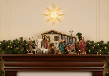 Real Life Nativity Set complete with 20 pieces, beautifully displayed on a mantel with star and festive decorations.