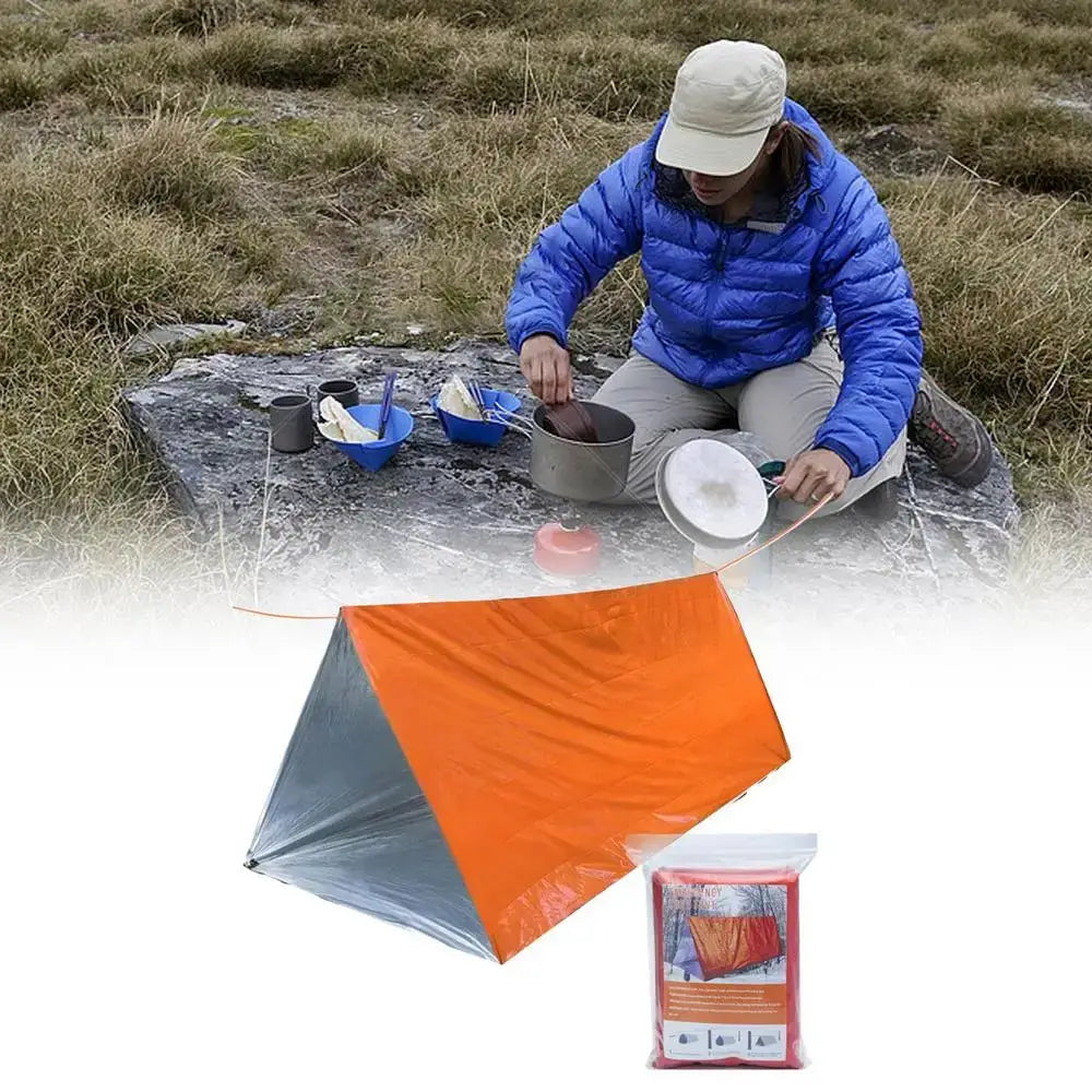 Outdoor Emergency Survival Tent and Blanket displayed with a camper cooking in nature, featuring an orange shelter.