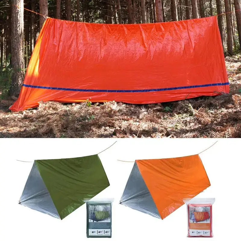 Outdoor Emergency Survival Tent and Blanket in orange and green colors set up in a forest.
