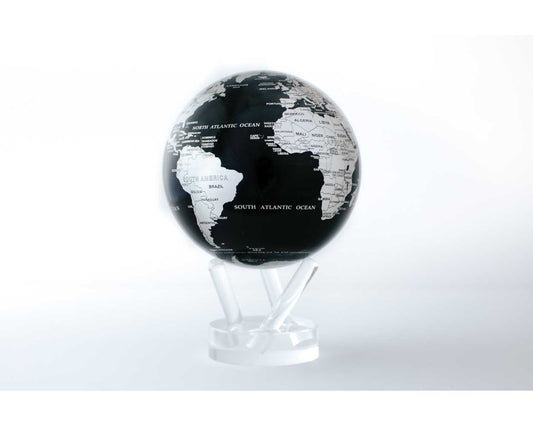 A black and silver MOVA Earth globe with metallic silver landmasses on a deep black ocean, displayed on a clear stand.