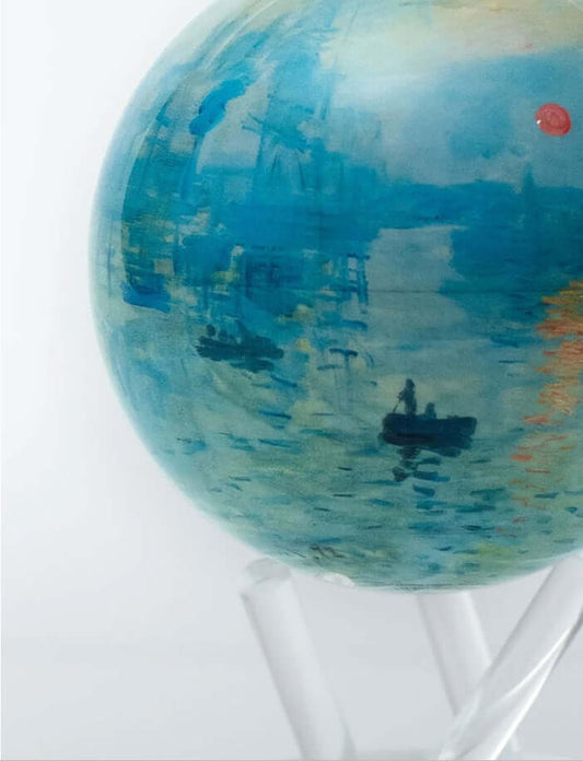 A rotating globe featuring the artwork 'Impression, Sunrise' by Claude Monet, displayed on a clear acrylic stand.