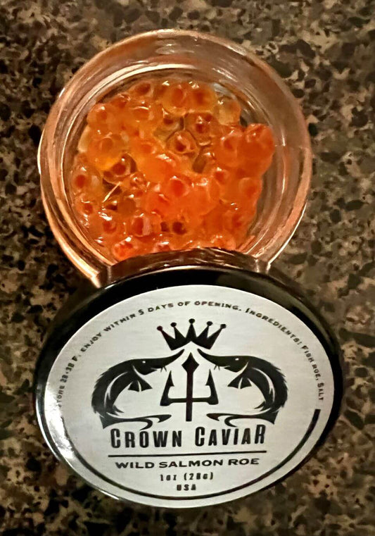 A label of Crown Caviar Wild Salmon Roe, indicating the product is 1 oz (28g) and sourced from the USA.