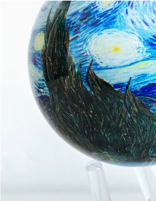 A rotating globe featuring the famous painting 'Starry Night' by Vincent van Gogh, displayed on a white stand.