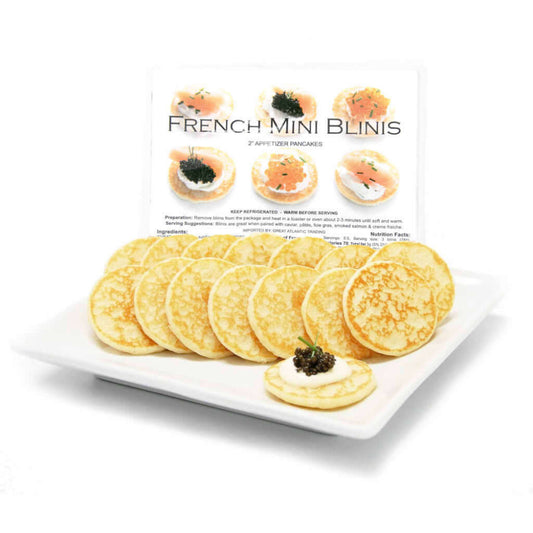 A package of French Cocktail Blinis displayed with multiple mini pancakes visible, intended for serving as an appetizer.