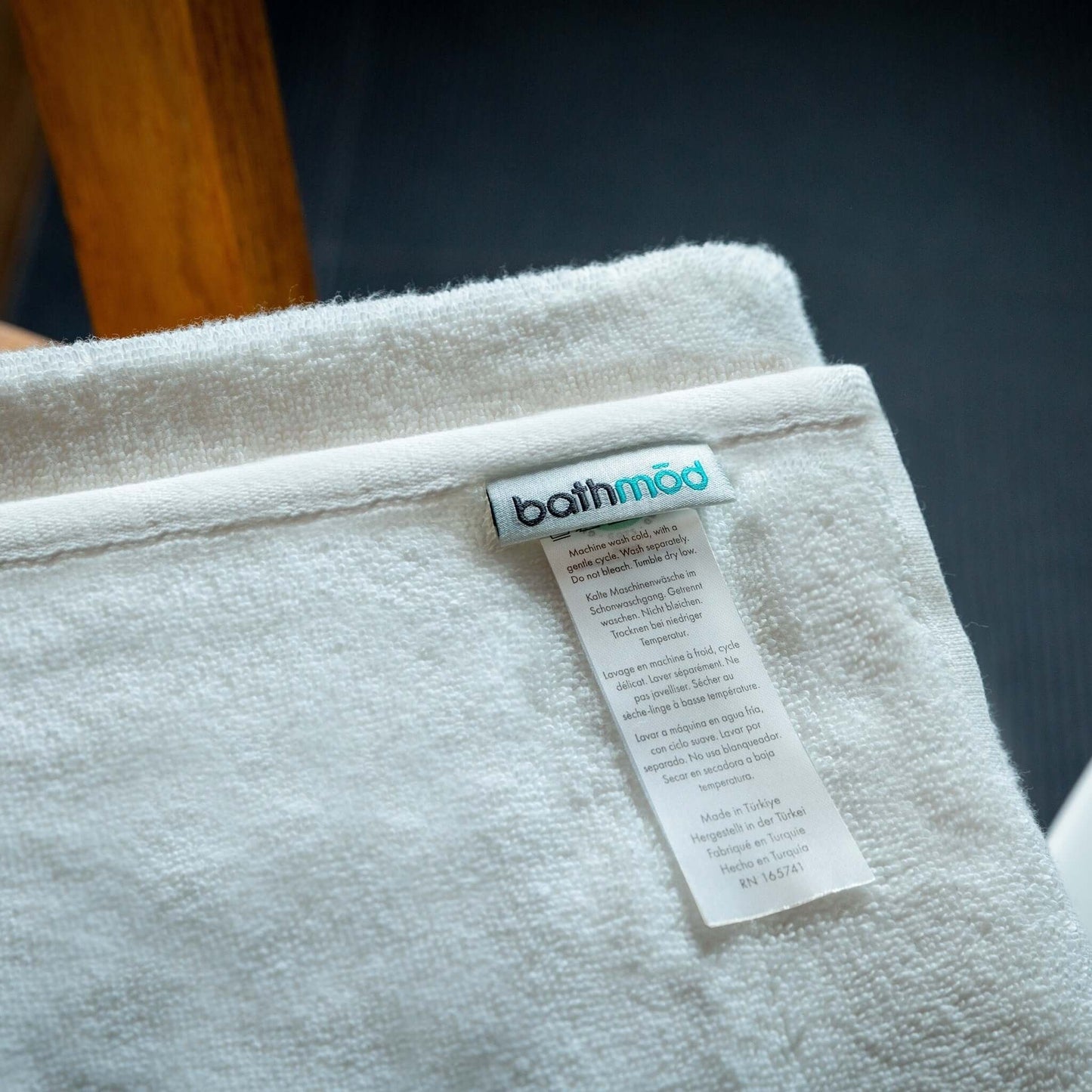 Luxury organic bath mats label showcasing eco-friendly material and care instructions.