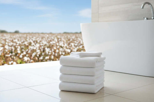 Luxury organic bath mats four pack displayed with packaging on a wooden table.