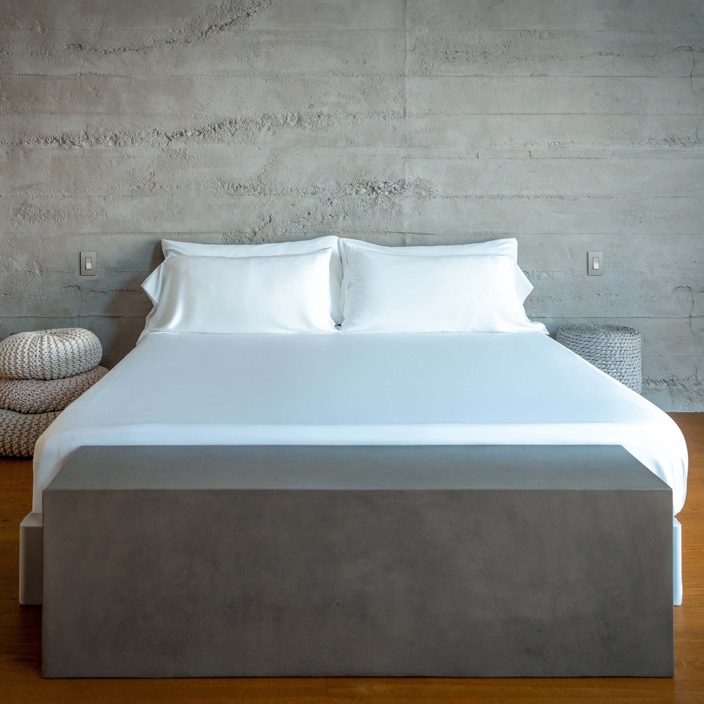 Eucalyptus silk sheets set on a modern bed with clean lines and minimalist decor.