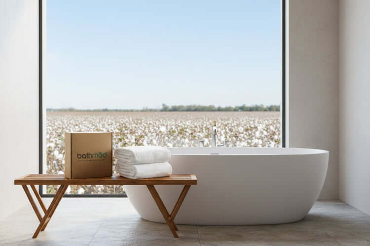 Luxury Organic Bath Sheets (Two Pack) displayed next to their eco-friendly box on a wooden table.