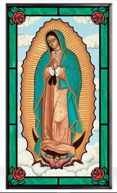 Stained glass window featuring the figure of Our Lady of Guadalupe with a blue-green mantle, prayed to by a child in a brown robe, set against a sky blue background with roses on the sides.